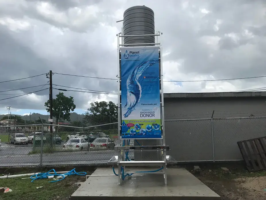 The water tower, provided by the Planet Water Foundation, is capable of supplying 1,000 residents with drinkable water daily. Rayo De Luna has installed 36 towers around the island. Image by Tomas Woodall Posada. United States, 2018.
