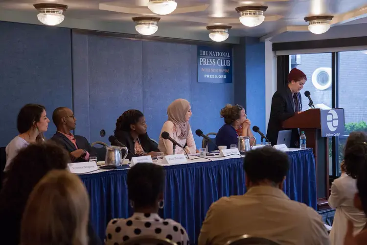 Pulitzer Center Fighting Words Poetry Contest 1st place winner Alex Holland, 11th grade student at Montgomery Blair High School, MD, reads 'Sickness of the Sprawling City' before the 'From the Ground Up: Building Peace Outside the Halls of Power' panel at the Beyond War conference. Image by Jin Ding. Washington, D.C., 2018.