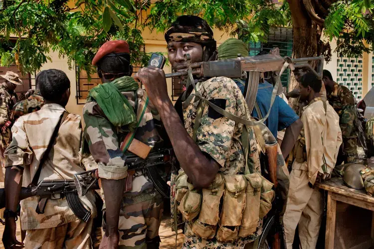 Although religion has little to do with how the conflict started, the violence has since divided the country along religious lines. Rebel groups calling themselves the Seleka (left), composed mostly of Muslims from the north, toppled the government in 2013. The Seleka’s brutal treatment of Christian and animist civilians led to the rise of the Anti-Balaka (right), local militias formed to drive the Seleka out of their towns and villages. Image by Markus Bleasdale. Central African Republic.