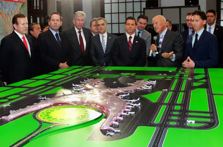 The architect Norman Foster (with mic), flanked by President Enrique Peña Nieto and architect Fernando Romero, with a model of the new Mexico City international airport. Image by Eruviel Ávila. Mexico, 2014.