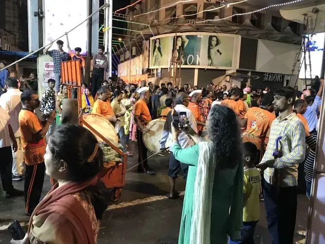Mumbai anti-noise activist Sumaira Abdulali checks the sound levels of a procession on the final night of the 10-day Ganesh festival, when thousands of idols are led by drums and other music down to the sea for ceremonial immersion. Image by Chris Berdik. India, undated.
