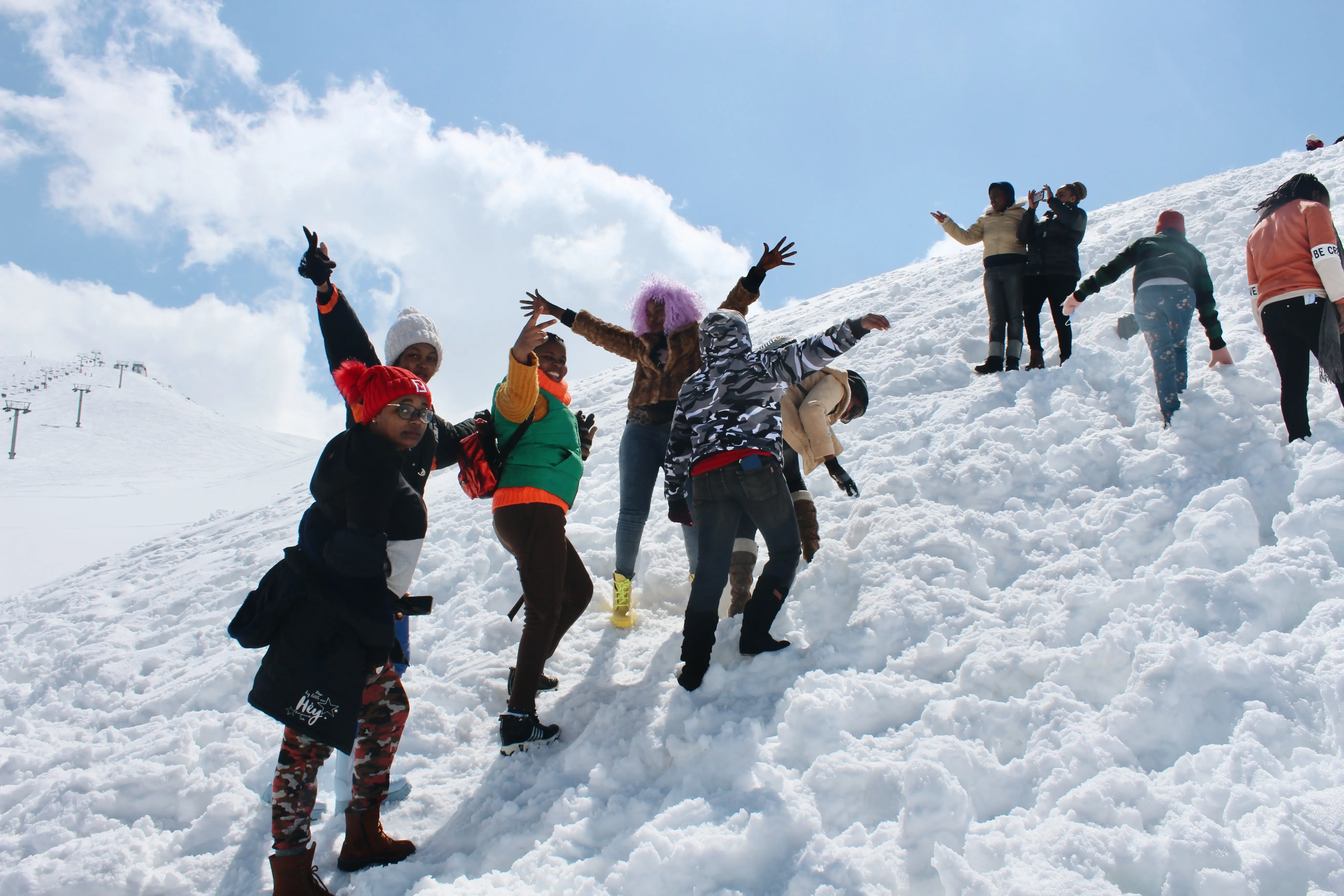 Kenyan migrant workers on snowy hillside