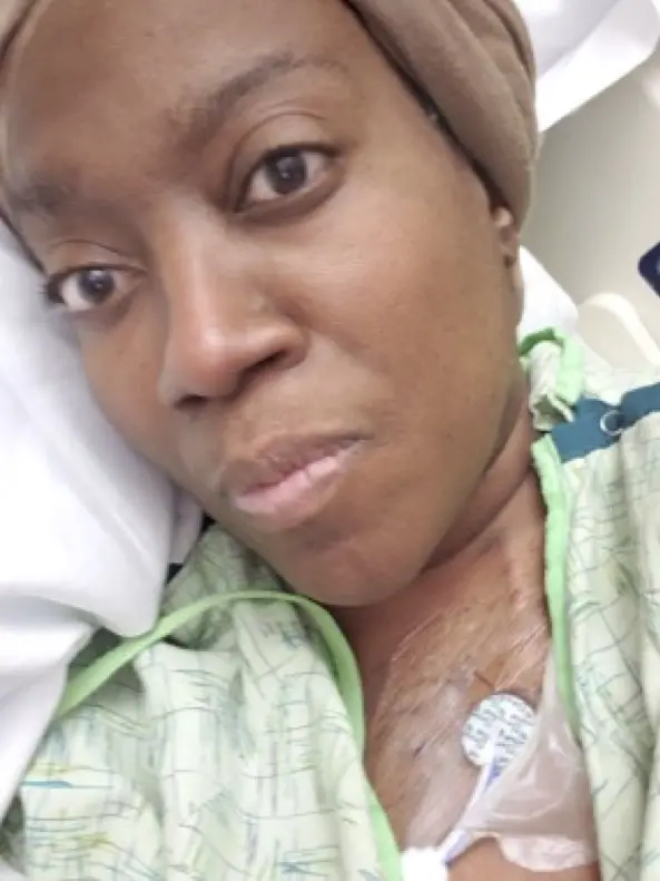 Image of Stephanie Gadlin lying in a hospital bed.