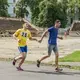 Oleksandr Popruzhenko (yellow) runs with teammate Oleksandr Radioniuk (blue) in the qualifying race for the marathon. Image by Oksana Parafeniuk, courtesy of Roads & Kingdoms. Ukraine, 2018.