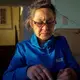 Aaju Peter sews a tie out of sealskin in her home. Image by Nick Mott. Canada, 2018.