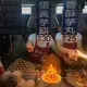 This stall sells taro fritters. In front is a pyramid of egg yolks used in the fritters. Image by Melissa McCart. Taiwan, 2018. 