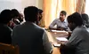 Pajhwok Afghan News director Danish Karokhel, center, leads an editors' meeting at the news agency last month. Image by Kathleen Flynn. Afghanistan, 2010.