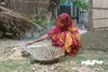 Young woman cooks eggs in Assam, India