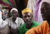 A resident of the village of Adouna, Niger, sits in a meeting with other villagers. Residents say Lutheran World Relief’s project to rebuild a dam near the village will increase usable farmland near the village and provide villagers with a way to get to market, thus increasing incomes.