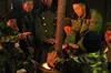 KIA soldiers warm themselves around a coal fire on cold night at Laisin. Image by Ryan Libre, Myanmar, 2009. 