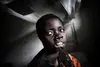 Mbonih Ndele Mari was abducted by the LRA outside Niangara and left for dead by them after they cut off her lips and her ears. She is now in a hospital in Niangara. Her children are being looked after by family close by.