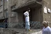 Staff and patients walk outside of the main Tuberculosis hospital in Balti, Moldova.