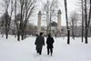 Men hurry to Friday prayers at the central mosque in Nalchik, the capital of the Russian republic of Kabardino-Balkaria. Image by Tom Parfitt. Russia, February 2011.