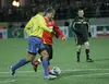 Ramzan Kadyrov (in red), the leader of Chechnya, plays in a friendly soccer match between Chechen players and a collection of Brazilian World Cup Winners in Grozny. Image: Musa Sadulayev, Russia, March 2011.
