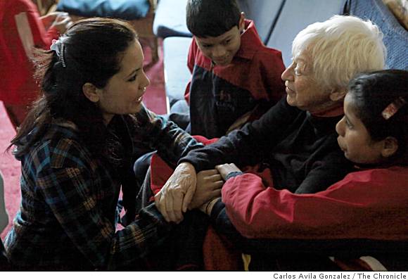 Olga Murray (right) speaks with several of the students at J and K House, the boys and girls schools she started for needy children in Kathmandu, Nepal. Her philanthropic endeavors have spanned over two decades for the poor and infirm, and for the past 10 years, her Nepalese Youth Opportunity Foundation has rescued over 4,300 girls from domestic slavery. Image by Carlos Avila Gonzalez. Nepal, 2009. Media file: 001-Nepal-Olga-Murray.jpg