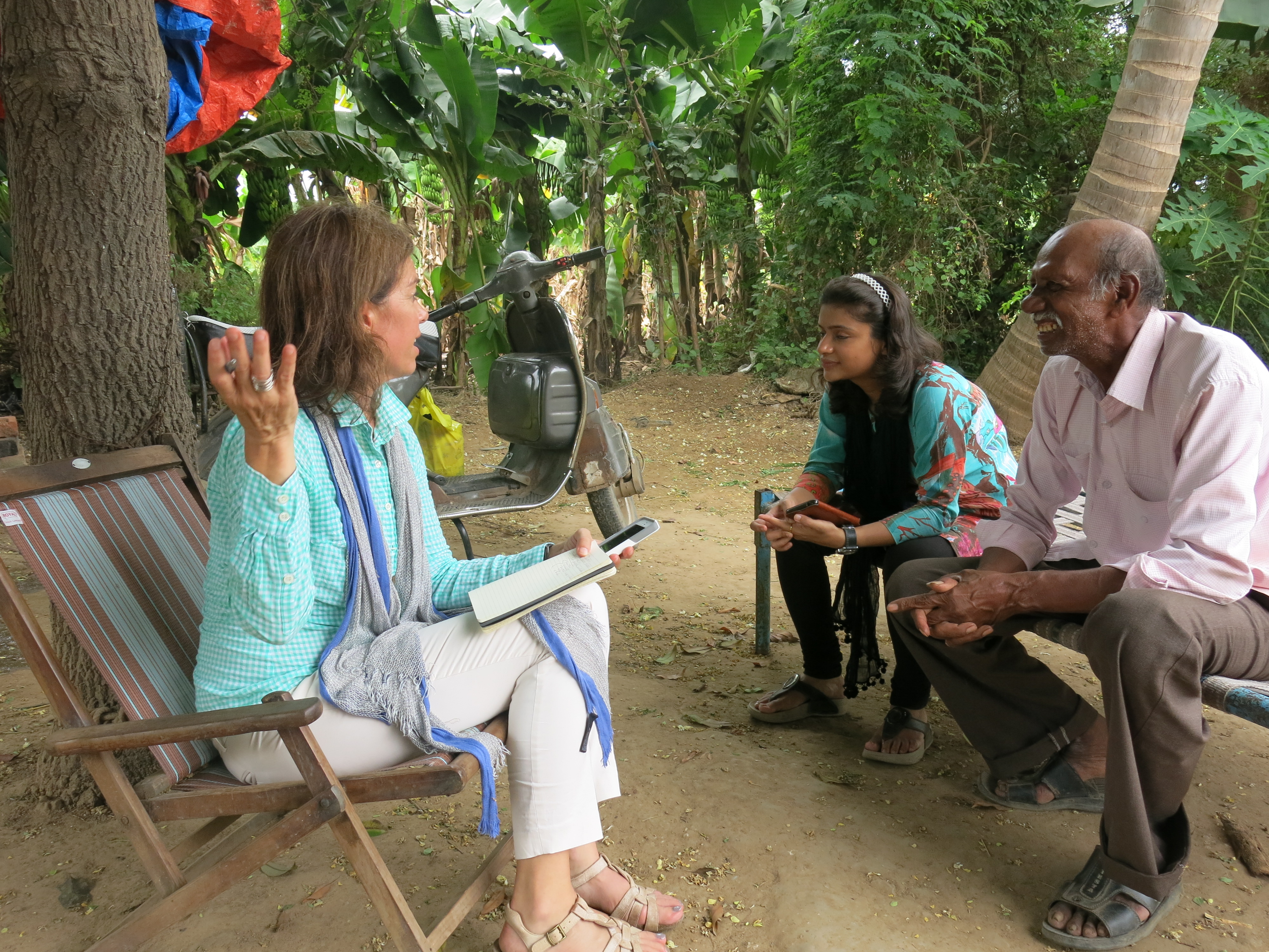 Lisa Palmer interviews a farmer in Gujarat. Image by Arun Khatri-Chhetri. India, 2016.