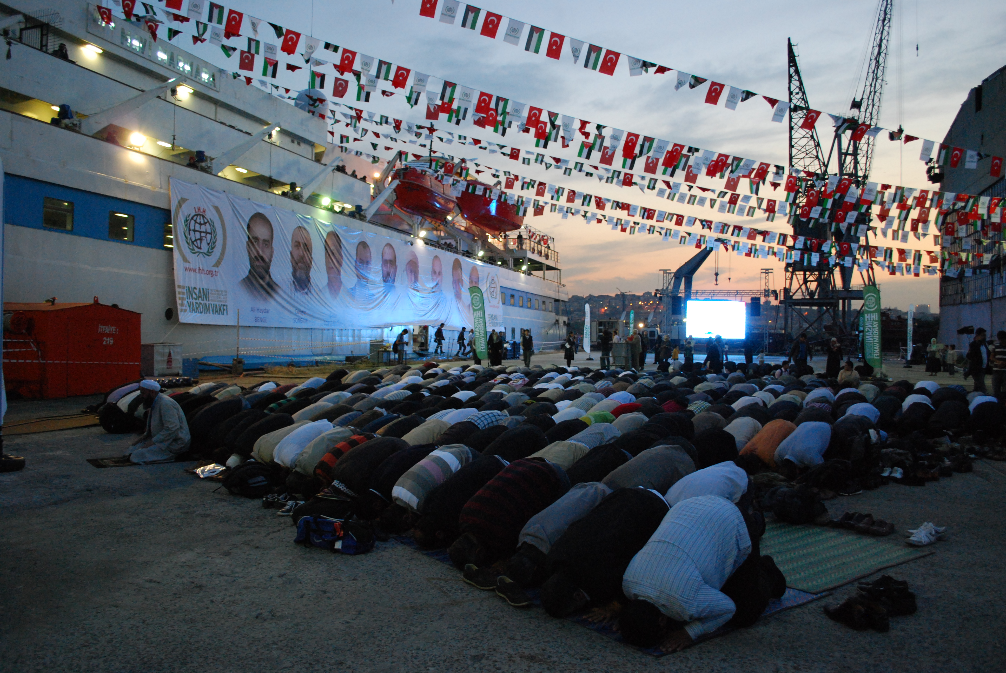Prayer at an anniversary marking the raid on the Mavi Marmara, which caused a major rift in Turkey-Israel relations. For some Turks the boat, which remains docked in Istanbul, and the incident are symbols of the Turkish commitment to aiding the Palestinians. Others argue that Erdogan's policies have intensified the divide between Turkey's Muslim and Jewish populations, leading to a rise in casual anti-Semitism. Image by Jenna Krajeski. Turkey, 2013. Media file: dsc_1076.jpg