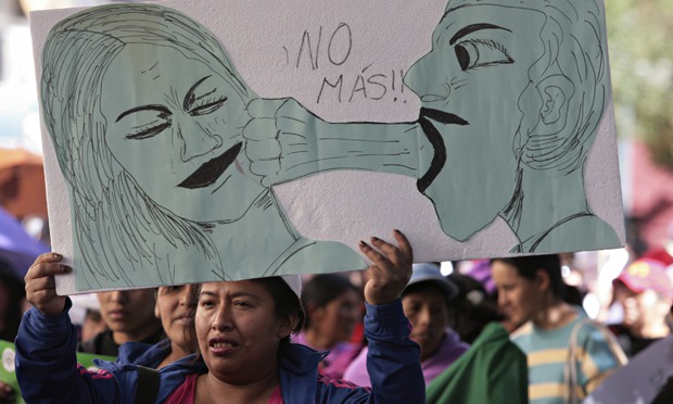 A woman holds a sign that reads ‘No more’ during a rally against abuse and domestic violence in La Paz. Image by Gaston Brito/Reuters. Bolivia, 2014. Media file: mdg-gender-violence-in-b-009.jpg