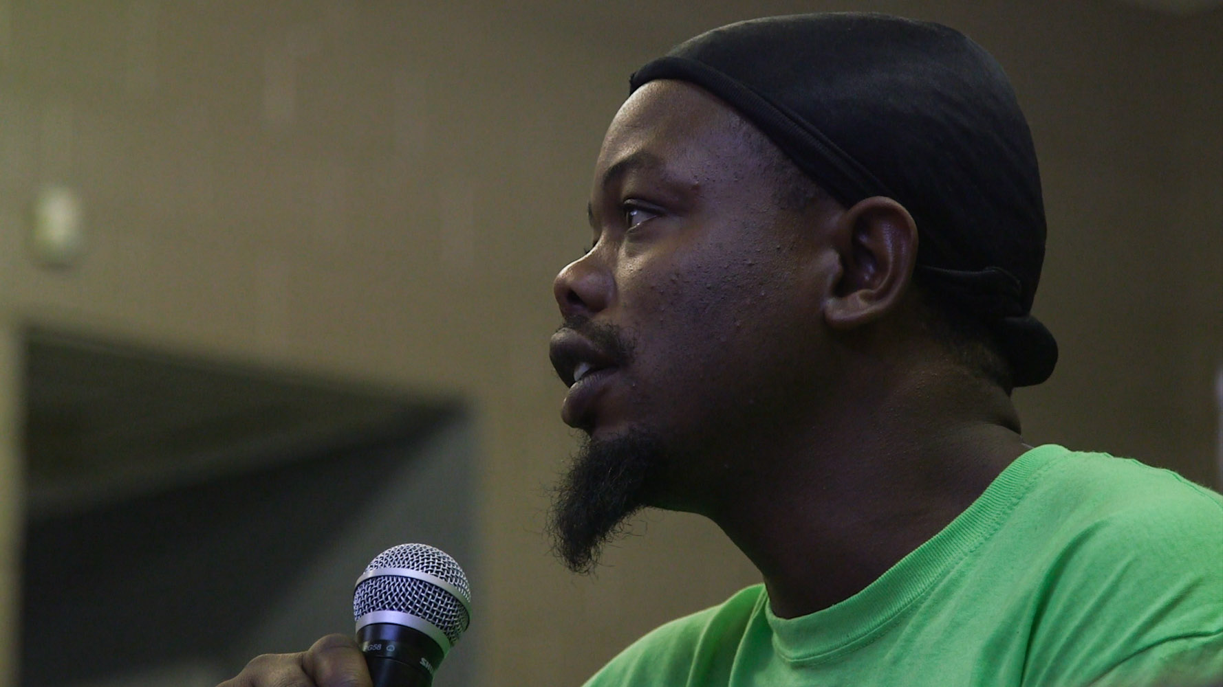 Lifeline for Success member Will raises questions about the electoral college. Lifeline is a re-entry program for formerly incarcerated men and women in Memphis, Tennessee. Most members of the community are disenfranchised. Video still by Lorraine A. Ustaris for Andrea Bruce's Our Democracy project. Media file: William