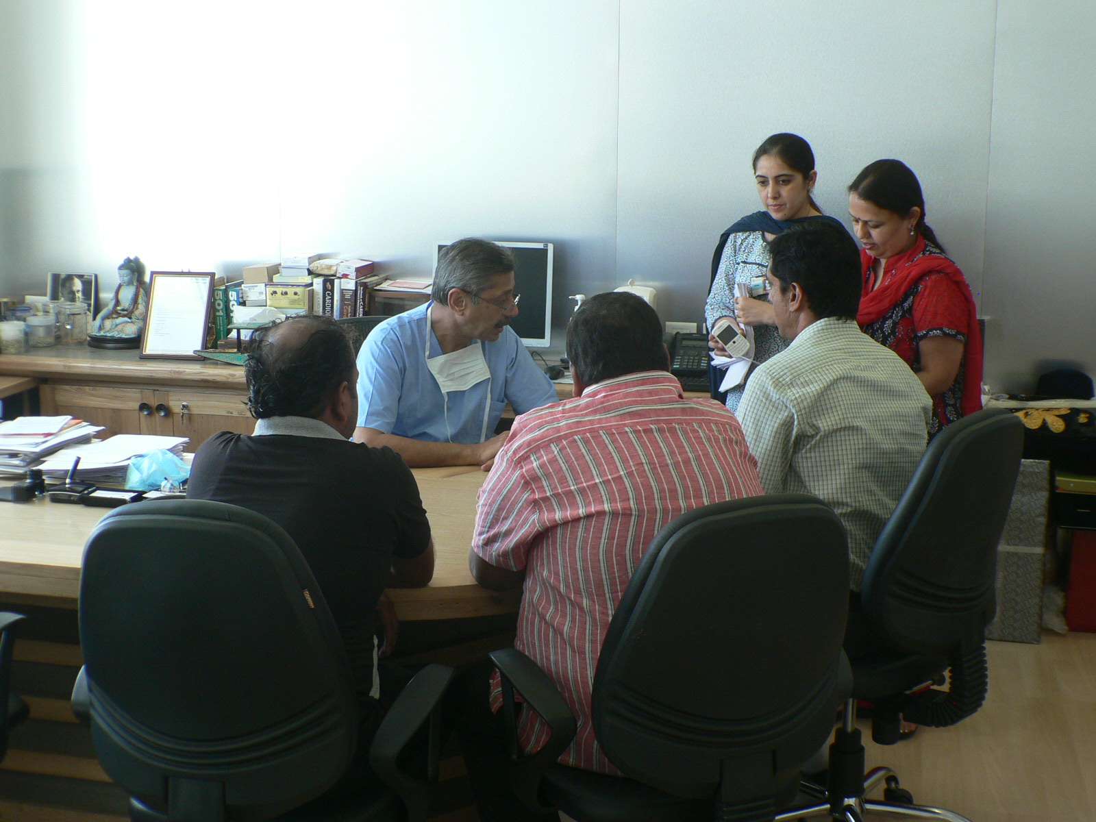 Patients talking with Dr. Naresh Trehan, India's leading heart surgeon, in Delhi. Image by Martina Merten, India, 2013. Media file: p1100278.jpg