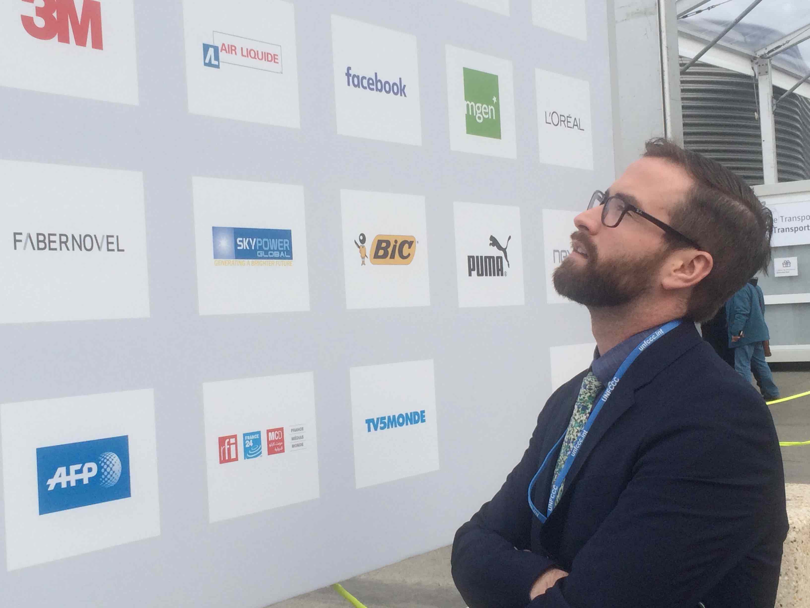 Dozens of companies picked up 20 percent of the bill for the Paris climate conference. Jesse Bragg, a spokesperson for Corporate Accountability International, says the list includes some of the world's worst polluters. Image by Daniel Grossman. France, 2015. Media file: img_0478.jpg