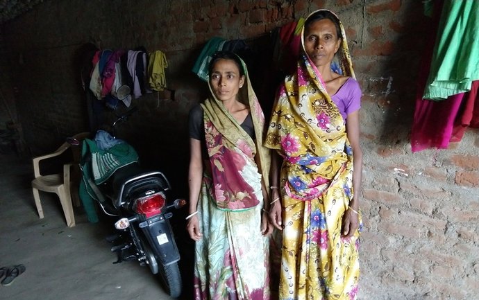 Two women attacked in a witch hunt, Madhuben and Susilaben, stand in an alley in Dahod District, Gujarat, India. Image by Seema Yasmin. India, 2017. Two women attacked in a witch hunt, Madhuben and Susilaben, stand in an alley in Dahod District, Gujarat, India. Image by Seema Yasmin. India, 2017.