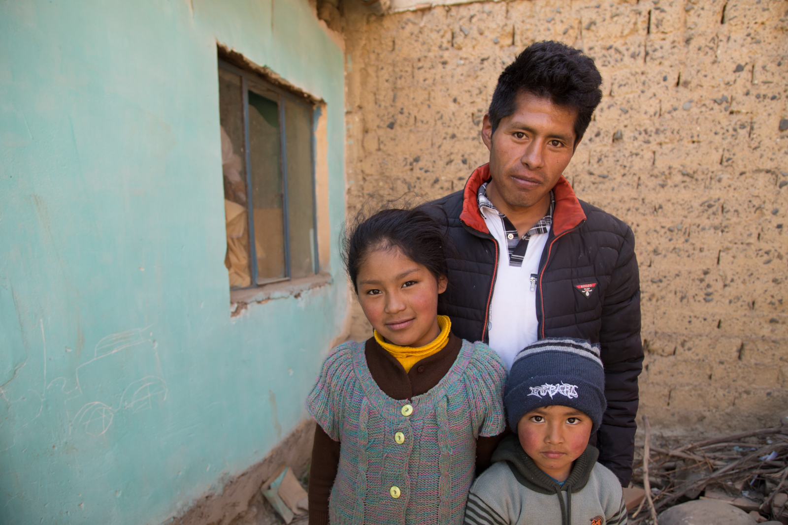 Victor Corhuari has been searching for his sister, Zulma, who was 16 when she went missing in April 2017. He is a single father and lives with his daughter Deysi, his son Neymar, and his sister's child, not shown. Image by Tracey Eaton. Bolivia, 2017. Victor Corhuari has been searching for his sister, Zulma, who was 16 when she went missing in April 2017. He is a single father and lives with his daughter Deysi, his son Neymar, and his sister's child, not shown. Image by Tracey Eaton. Bolivia, 2017.