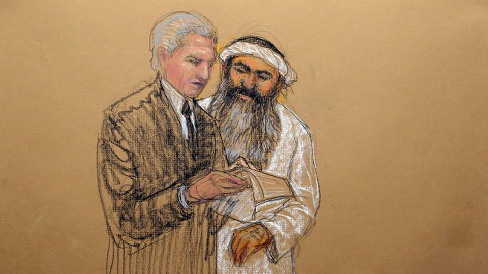 In this sketch by courtroom artist Janet Hamlin and reviewed by the U.S. Department of Defense, Khalid Sheik Mohammed, right, consults with his civilian attorney David Nevin during a break of his military hearing at the U.S. Navy base at Guantanamo Bay. Image by Janet Hamlin. Cuba, 2012. In this sketch by courtroom artist Janet Hamlin and reviewed by the U.S. Department of Defense, Khalid Sheik Mohammed, right, consults with his civilian attorney David Nevin during a break of his military hearing at the U.S. Navy base at Guantanamo Bay. Image by Janet Hamlin. Cuba, 2012.