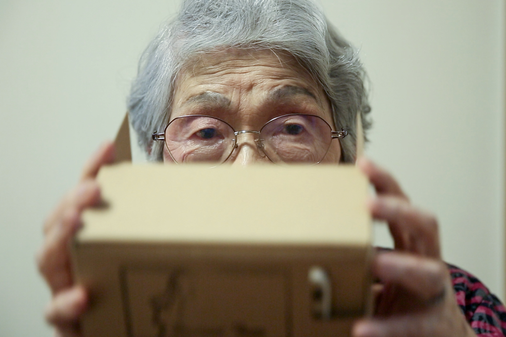 Tama Mitsui, 95, is an avid VR traveller. She says VR added new joy to her life. Image by Shiho Fukada. Japan, 2018. Media file: still004.jpg