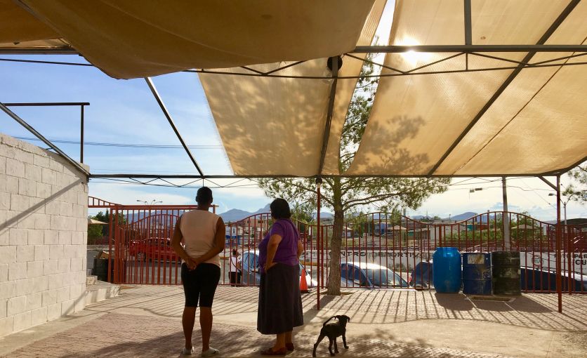 Sister Maria Antonia Aranda and a migrant woman from Cuba confer outside a church in Juárez, Mexico in August 2019. Image by Lily Moore-Eissenberg. Mexico, 2019. Sister Maria Antonia Aranda and a migrant woman from Cuba confer outside a church in Juárez, Mexico in August 2019. Image by Lily Moore-Eissenberg. Mexico, 2019.
