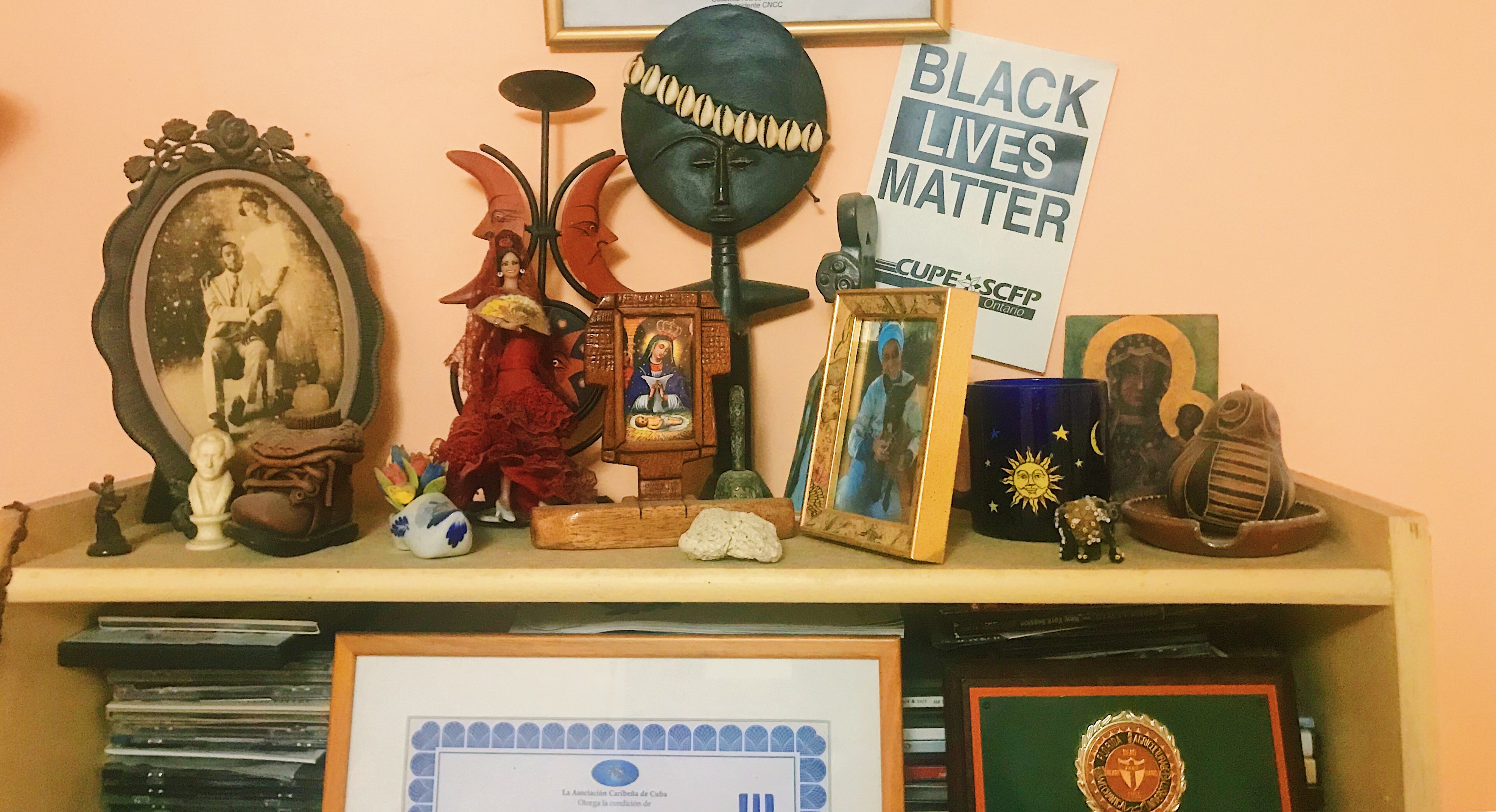 Black Lives Matter poster from a rally in Ontario, Canada, is displayed among some of documentary-filmmaker Gloria Rolando's possessions in Havana. Image by Esohe Osabuohien. Cuba, 2018. Black Lives Matter poster from a rally in Ontario, Canada, is displayed among some of documentary-filmmaker Gloria Rolando's possessions in Havana. Image by Esohe Osabuohien. Cuba, 2018.