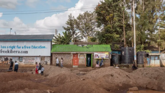 Christ Miracle Church, center, originally built as a public toilet, in Kibera, Nairobi. Image by Peter DiCampo. Kenya, 2018. Christ Miracle Church, center, originally built as a public toilet, in Kibera, Nairobi. Image by Peter DiCampo. Kenya, 2018.