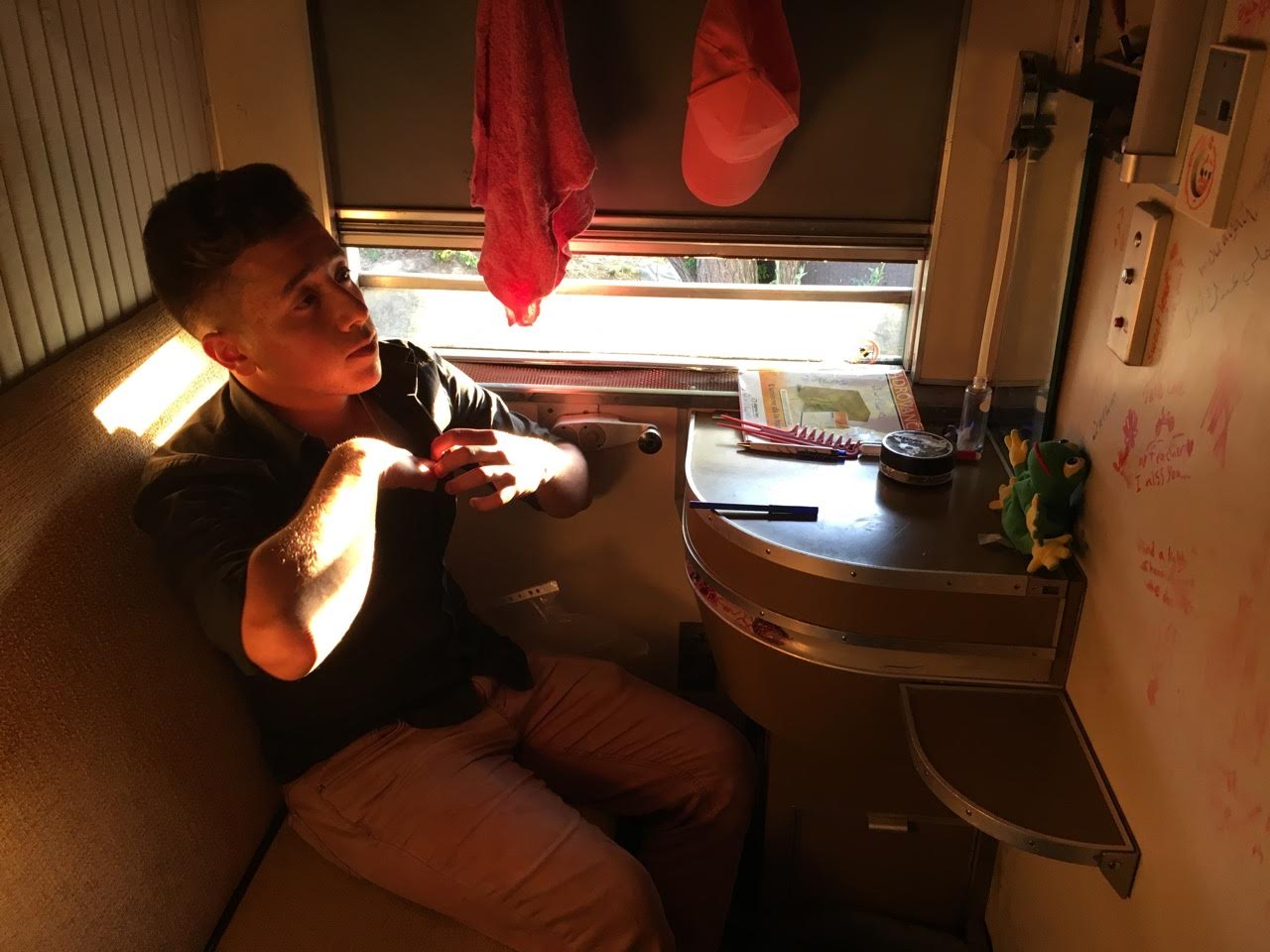 Moayad Alsaour lived in an abandoned sleeper car in Idomeni refugee camp in northern Greece. Image by Jeanne Carstensen. Greece, 2016. Moayad Alsaour lived in an abandoned sleeper car in Idomeni refugee camp in northern Greece. Image by Jeanne Carstensen. Greece, 2016.