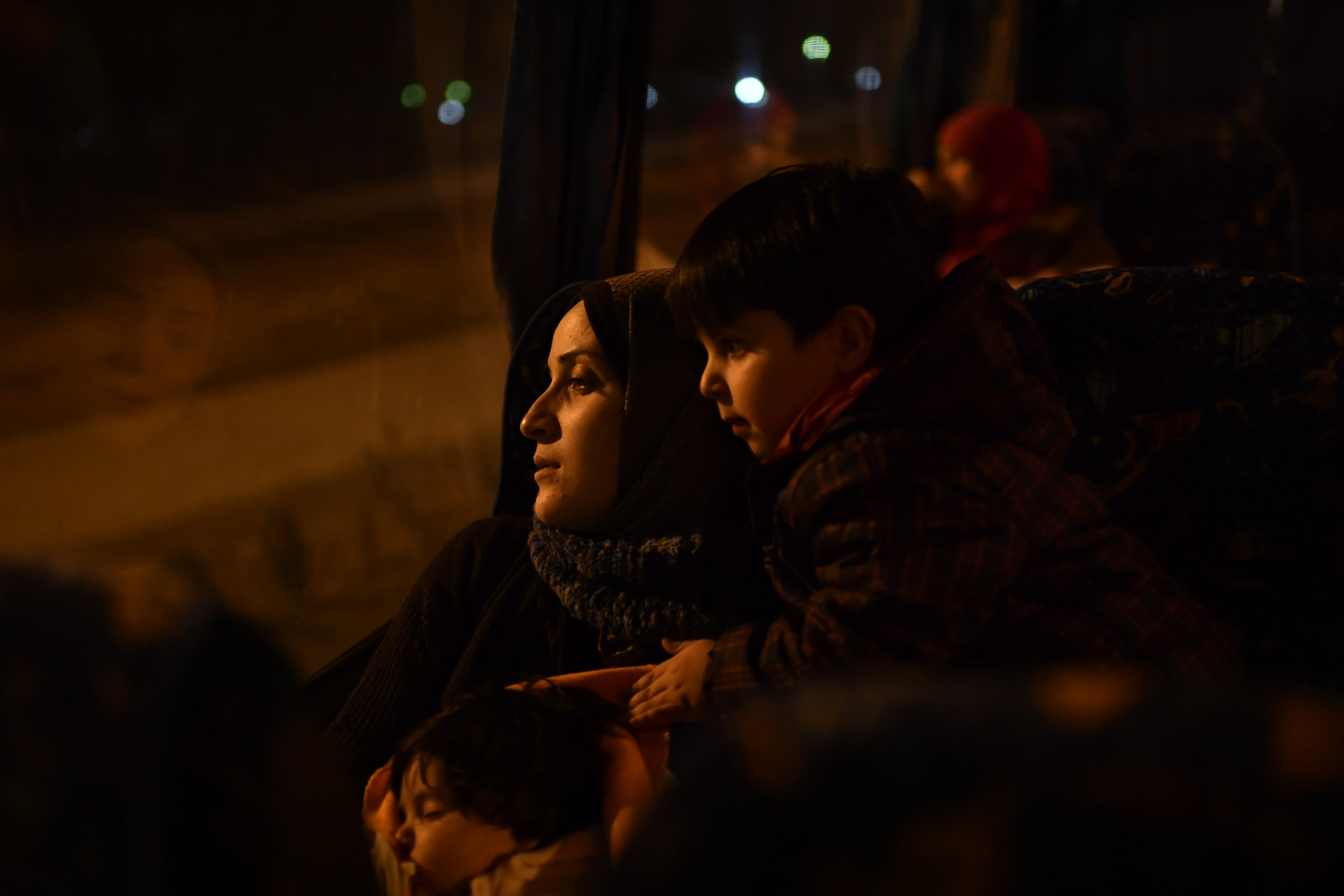 Taimaa, a young Syrian mother of two, takes the overnight bus from Thessaloniki to Athens to find out which European country has decided to accept her claim for asylum. It is a time fraught with uncertainty. Will she get Germany? France? Or a country she has never heard of? Image by Lynsey Addario. Greece, 2017. Taimaa, a young Syrian mother of two, takes the overnight bus from Thessaloniki to Athens to find out which European country has decided to accept her claim for asylum. It is a time fraught with uncertainty. Will she get Germany? France? Or a country she has never heard of? Image by Lynsey Addario. Greece, 2017.