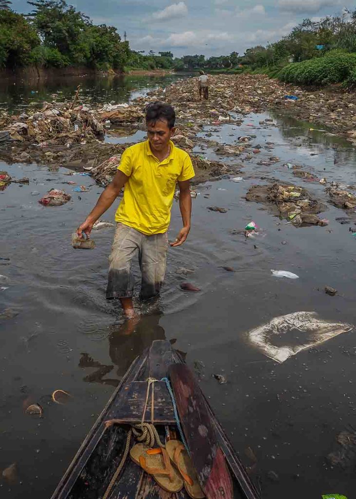 A 2013 study found that for most measures of water quality, the Upper Citarum River was far outside mandatory limits. Today, the river remains contaminated with factory effluent, sewage, animal waste, and household garbage. Image by Larry C. Price. Indonesia, 2016. A 2013 study found that for most measures of water quality, the Upper Citarum River was far outside mandatory limits. Today, the river remains contaminated with factory effluent, sewage, animal waste, and household garbage. Image by Larry C. Price. Indonesia, 2016.