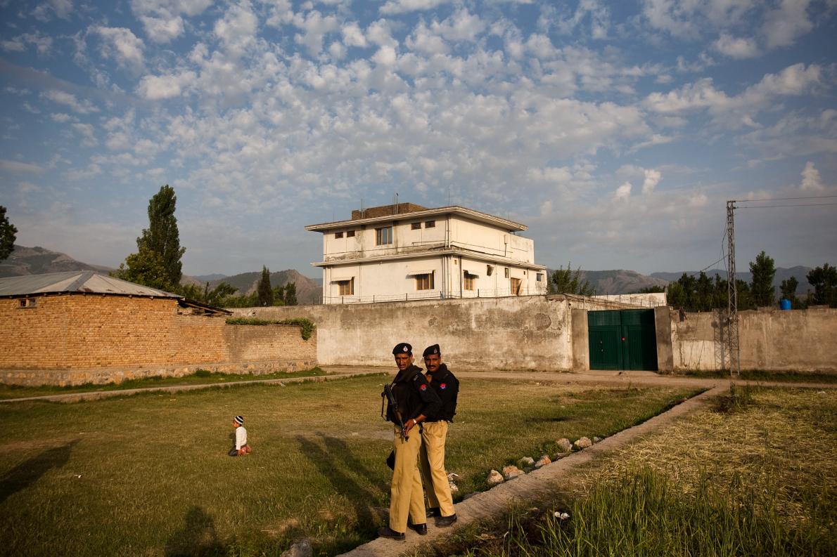 Police guard the compound in Abbottabad, Pakistan, where Osama bin Laden was killed by U.S. Navy SEALs on May 2, 2011. In the weeks leading up to the raid, a Pakistani doctor attempted to access the compound and was able to provide vital information to the CIA. Image by Warrick Page, Redux Media file: 01polio_2_pakistan_binladen.adapt_.1190.1.jpg