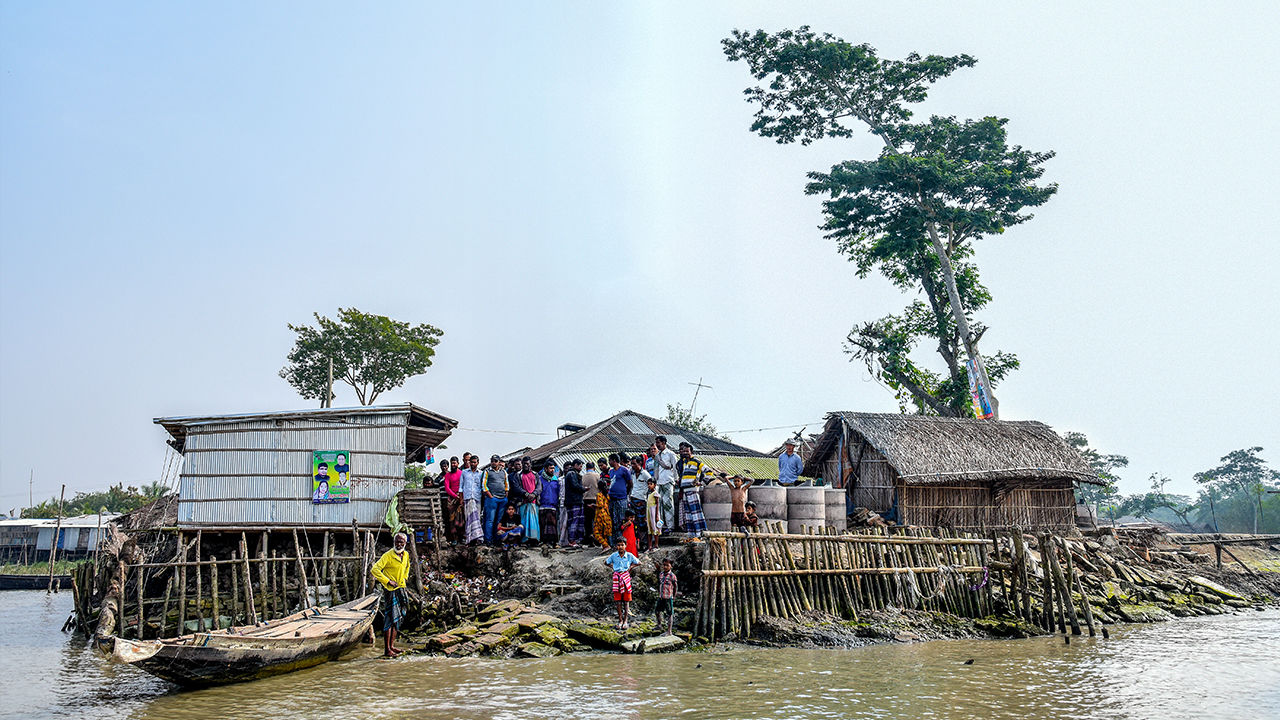 Villagers cluster on Polder 32, an artificial island in southwest Bangladesh with an uncertain future. Image by Tanmoy Bhaduri. Bangladesh, 2017. Villagers cluster on Polder 32, an artificial island in southwest Bangladesh with an uncertain future. Image by Tanmoy Bhaduri. Bangladesh, 2017.