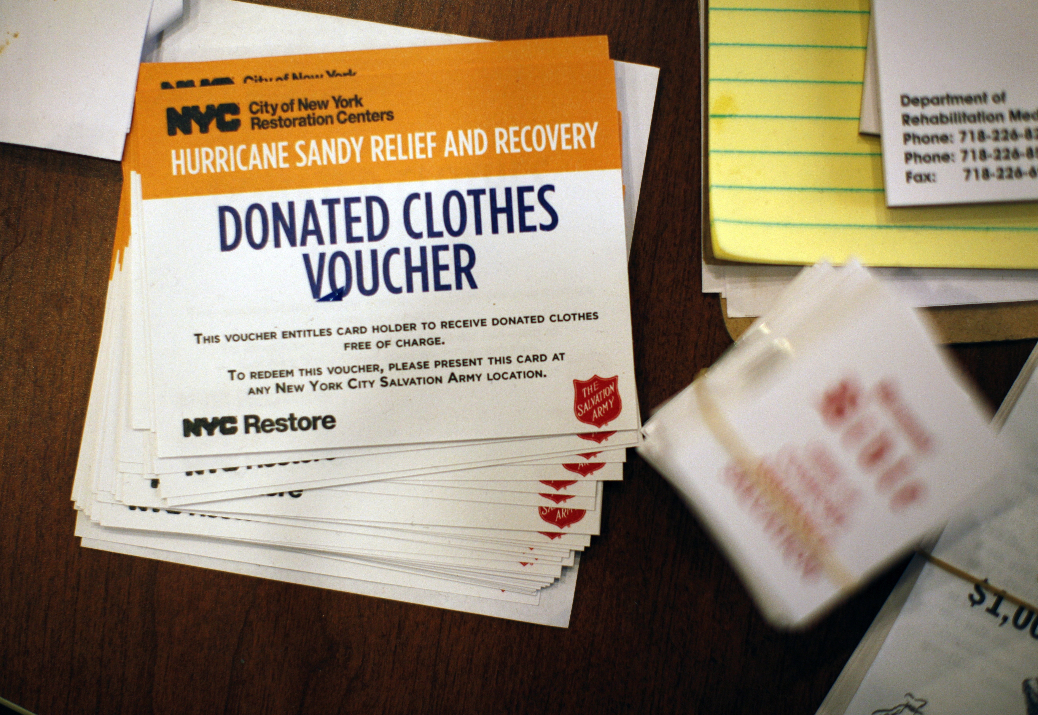 New York City donations vouchers sit on a table at the Oasis Christian Center in the Midland Beach area of Staten Island, New York, November 14, 2012. Image by Brendan McDermid/Reuters. United States, 2012. Media file: sandy-relief.jpg