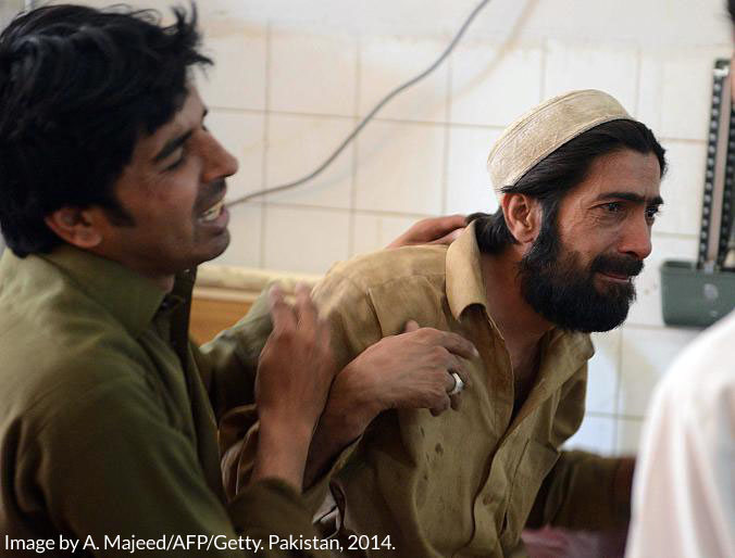 Relatives mourn a female polio health worker murdered in Peshawar. In Pakistan many of the polio vaccinators are women, who earn as little as five dollars per day. Image by A. Majeed, AFP/GETTY. Pakistan, 2014. Media file: 1polio-6.adapt_.676.1.credit.jpg