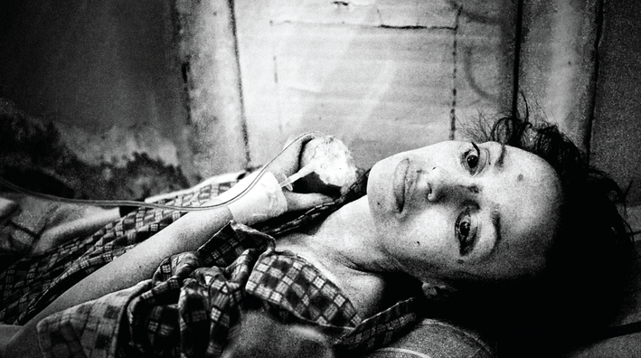 A woman inside the Botkin Infectious Disease Hospital in St. Petersburg, Russia. Image by Misha Friedman. Russia, 2013. Media file: polina.png