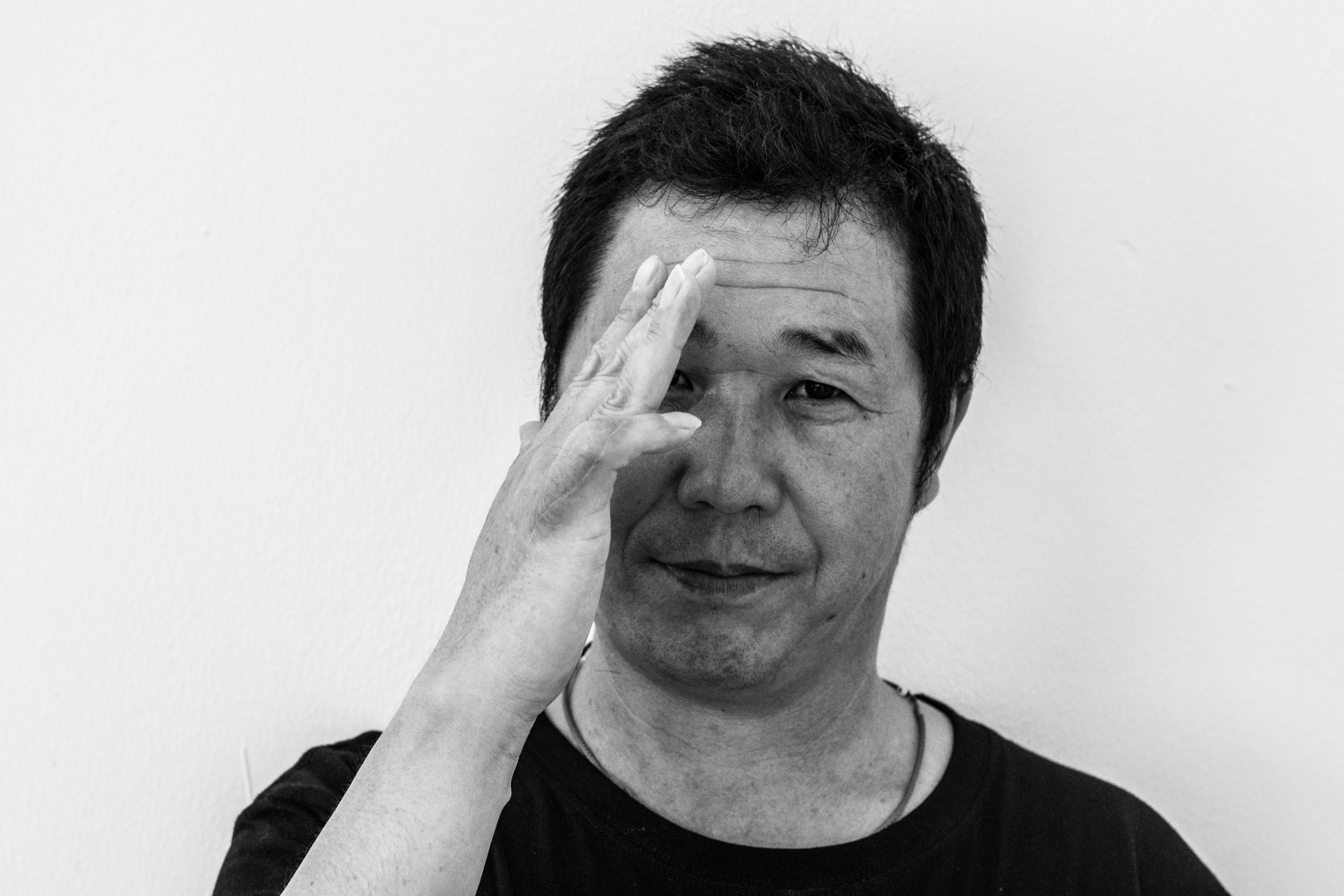 Zhang Yong Cheng, a 47 year-old butcher from China, shows his finger that was cut with a blade. His employer misreported this case when he was injured at work, and he was also underpaid, he said. Image by Xyza Bacani. Singapore, 2017. Zhang Yong Cheng, a 47 year-old butcher from China, shows his finger that was cut with a blade. His employer misreported this case when he was injured at work, and he was also underpaid, he said. Image by Xyza Bacani. Singapore, 2017.