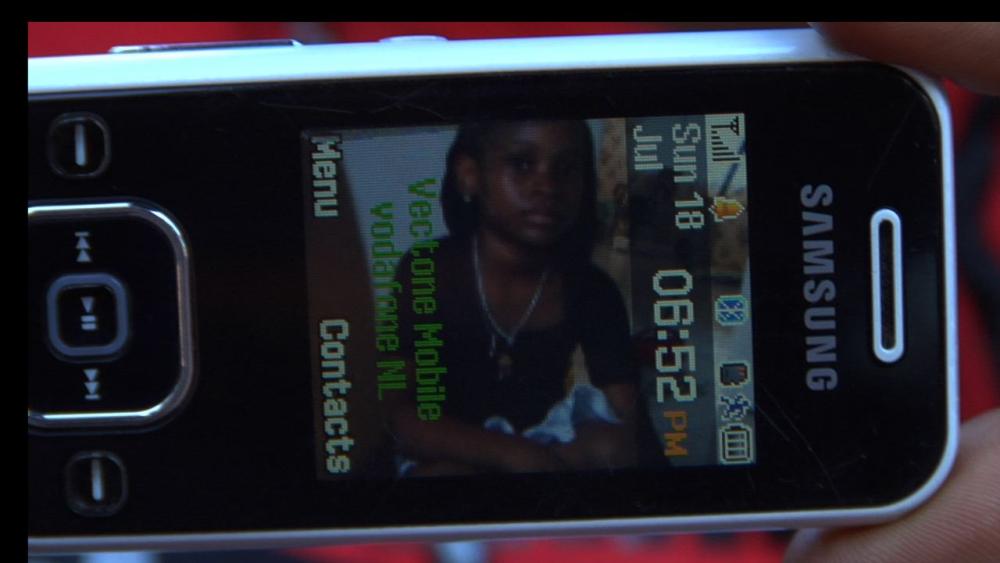 Simone left her daughter Khayla behind in Jamaica in her bid for asylum. During their separation, Simone kept Khayla's photo on her cell phone. Image by Micah Fink. Netherlands, 2009.