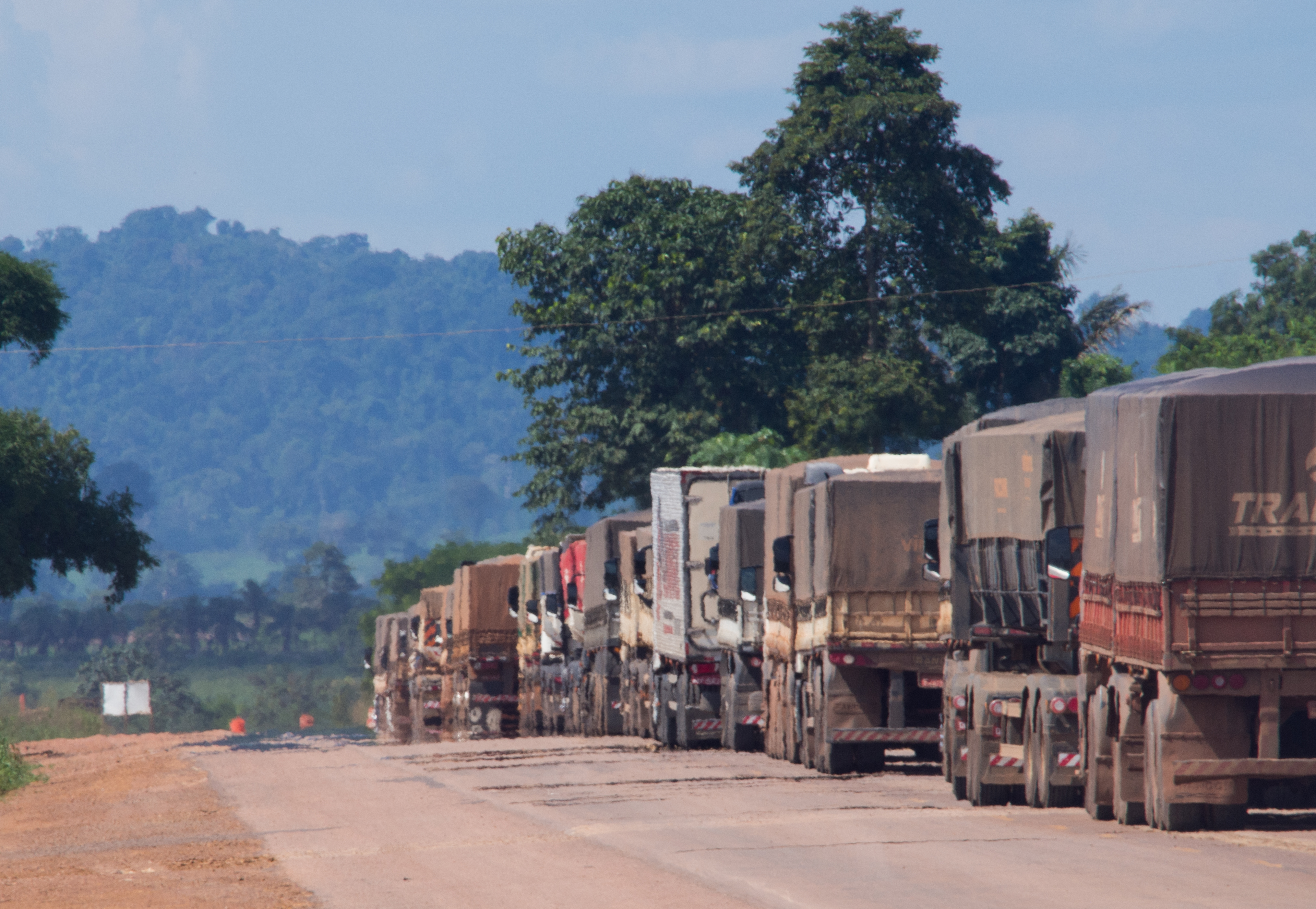 Trucks carry soy, corn, and beef along one of the main highways cutting across the Amazon basin. Much of these food commodities are bound for China. Image by Heriberto Araújo. Brazil, 2019. Trucks carry soy, corn, and beef along one of the main highways cutting across the Amazon basin. Much of these food commodities are bound for China. Image by Heriberto Araújo. Brazil, 2019.