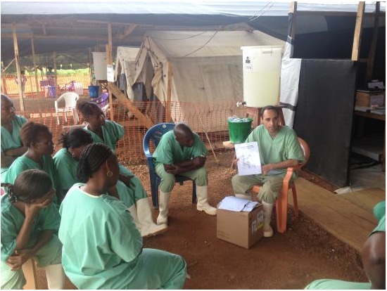 Médecins Sans Frontières (Doctors Without Borders) physician Benjamin Black trains workers in caring for pregnant women with Ebola. Image courtesy of Benjamin Black. Media file: doctors_in_sierre_leone.jpg
