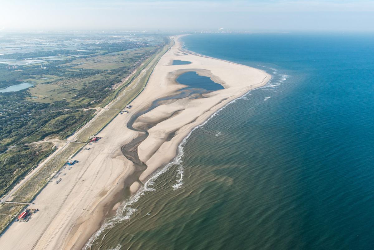 The Sand Motor project used natural forces to spread sand to protect a portion of the Dutch coast. Image by Rijkswaterstaat. The Netherlands, 2020. The Sand Motor project used natural forces to spread sand to protect a portion of the Dutch coast. Image by Rijkswaterstaat. The Netherlands, 2020.