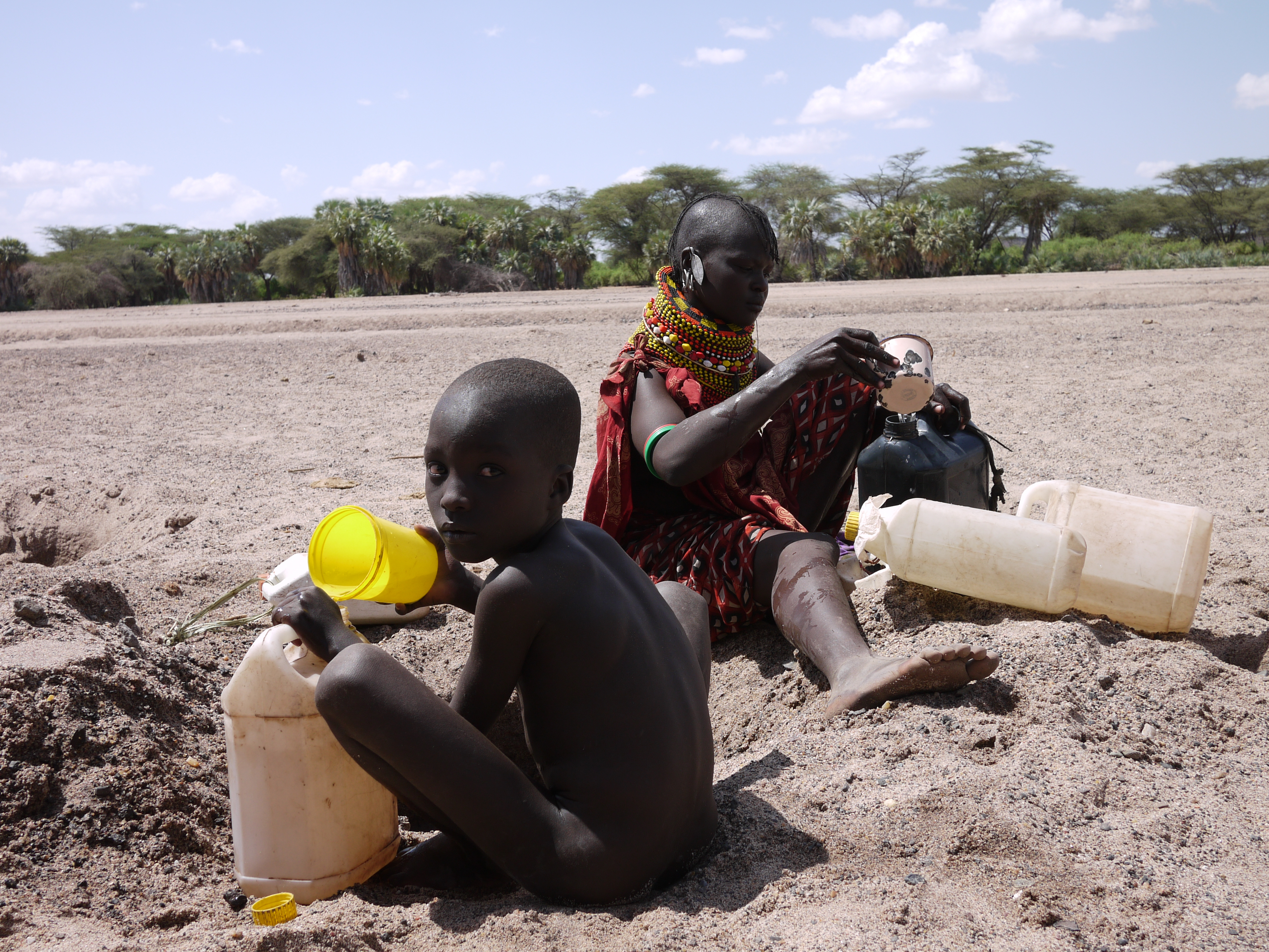 In Turkana, Kenya, a community of 600 people get their water from a hole in the ground after their water pump broke. Children have become sick drinking the dirty water, village elders say. Image by Samuel Loewenberg. Kenya, 2014. Media file: p1090773.jpg