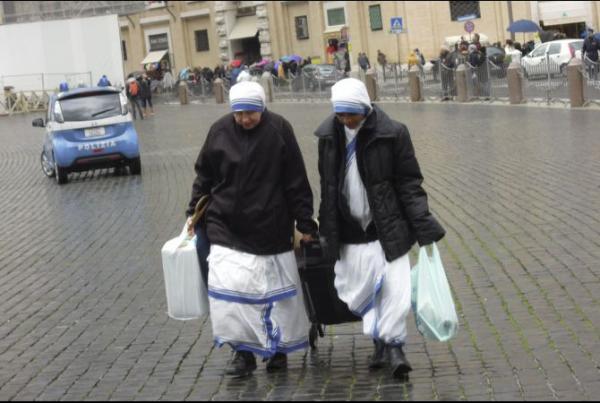 Two nuns crossing St. Peter's Square. Image by Jason Berry. Vatican City, 2012.