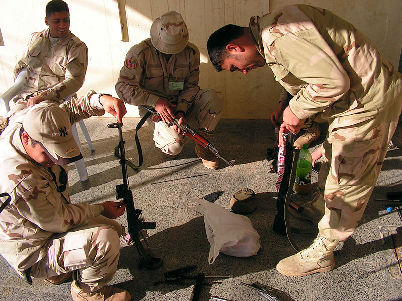 Peshmurga Kurdish Militia, cleaning and maintaining weapons at USACE villa, Erbil. Image by Jim Gordon. Kurdistan, 2005. Media file: Peshmurga_Kurdish_Militia.jpg