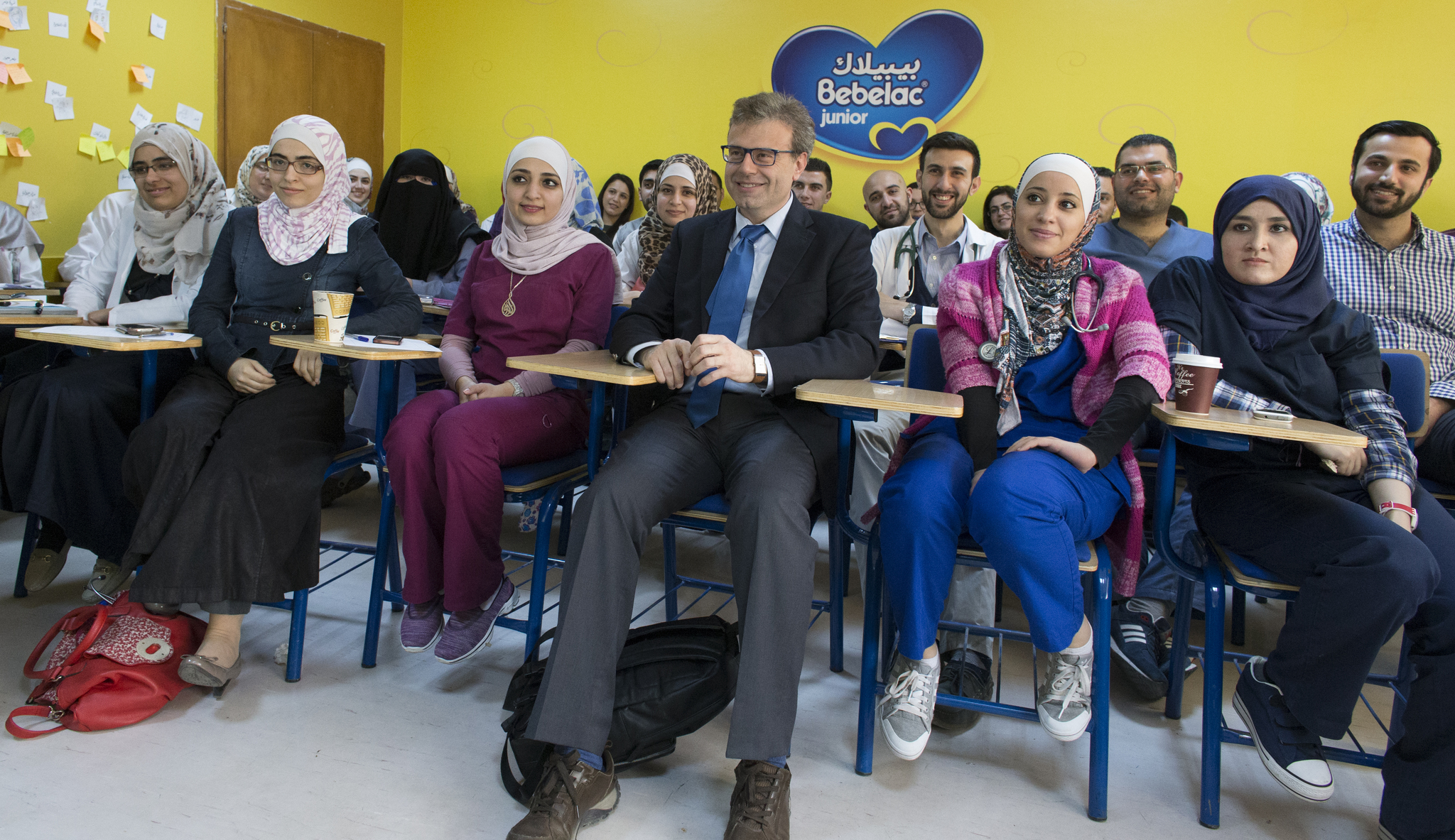 Syrian-born pediatric neurologist Tarif Bakdash (center) poses for a photo after speaking to a group of students, residents and faculty at the University of Jordan Medical School. Image by Mark Hoffman. Jordan, 2016. Media file: jordan_trip1.jpg