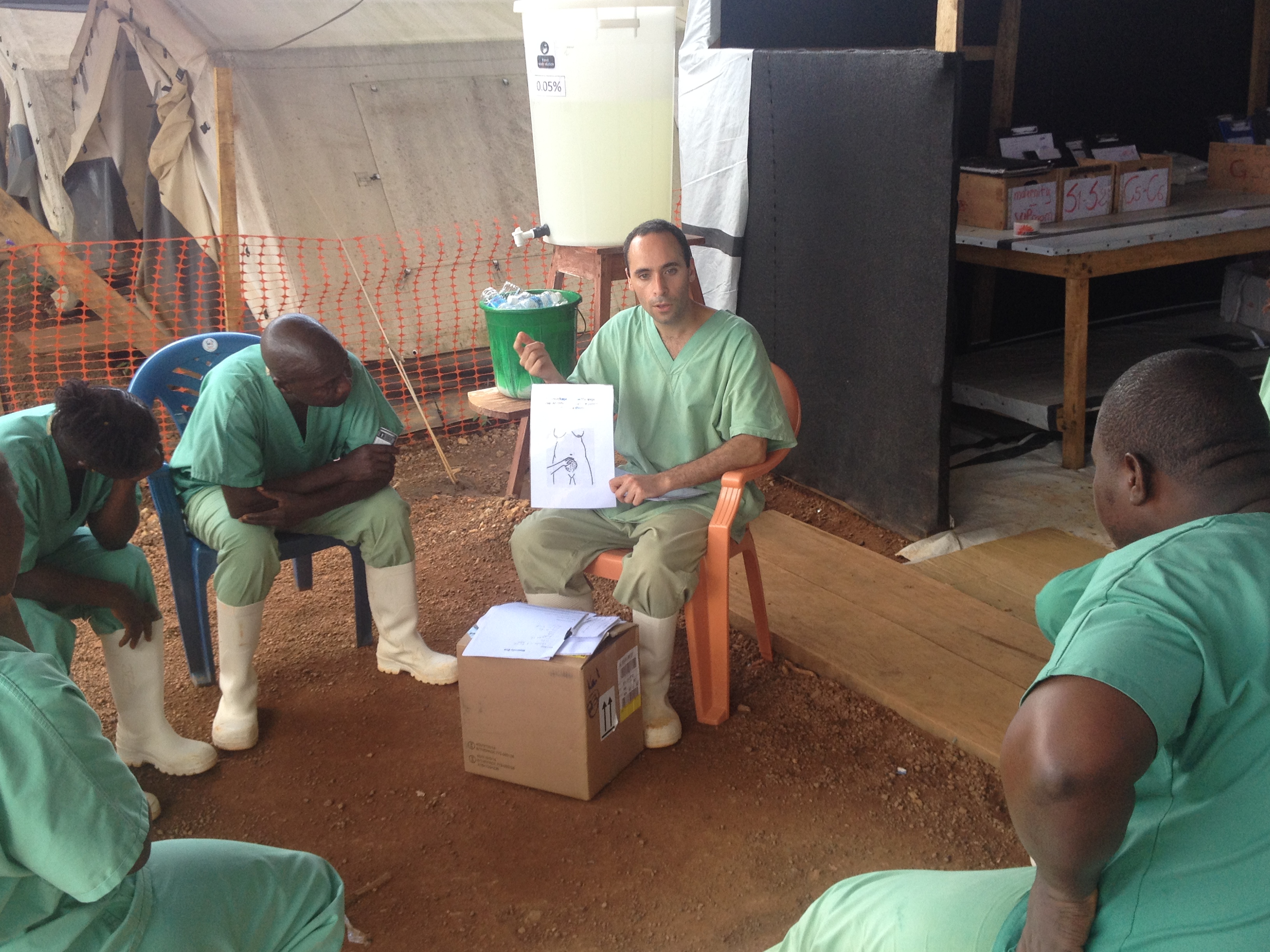 Obstetrician Benjamin Black trains health workers in treating pregnant Ebola patients. Image by Erika Check Hayden. Sierra Leone, 2014. Media file: img_1357.jpg